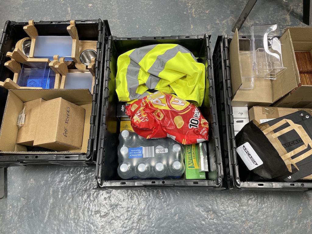Open boxes with assorted essentials for the expo